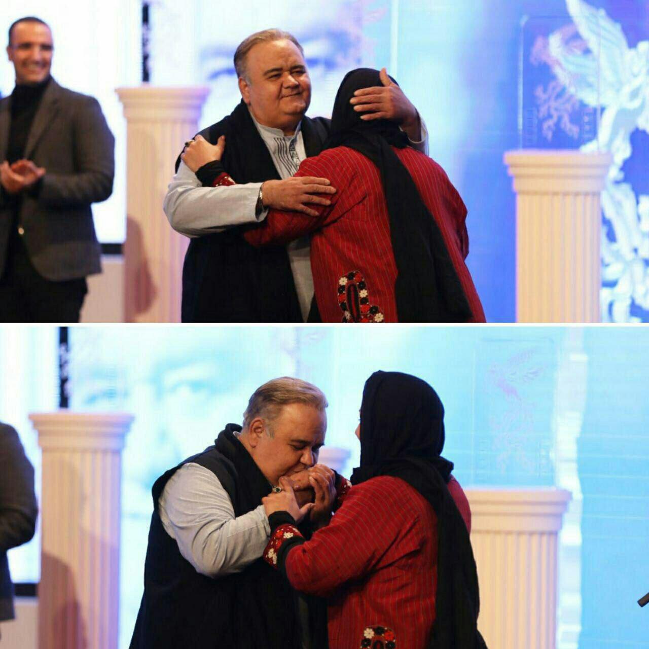 بوسه اكبر عبدى بر دستان همسرش/عکس